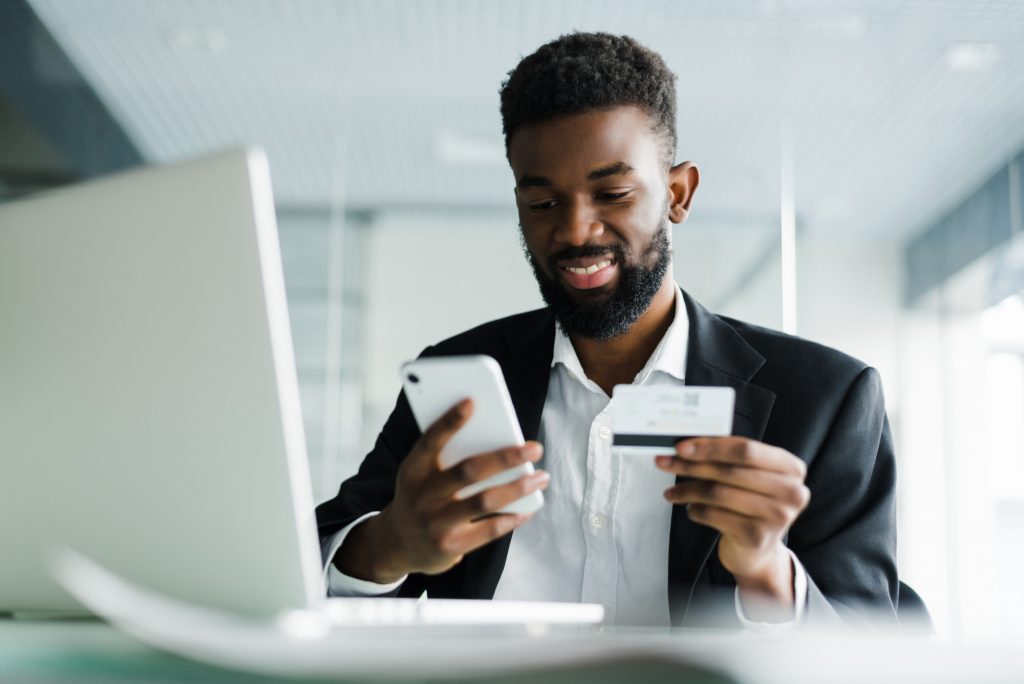 man using credit card celphone