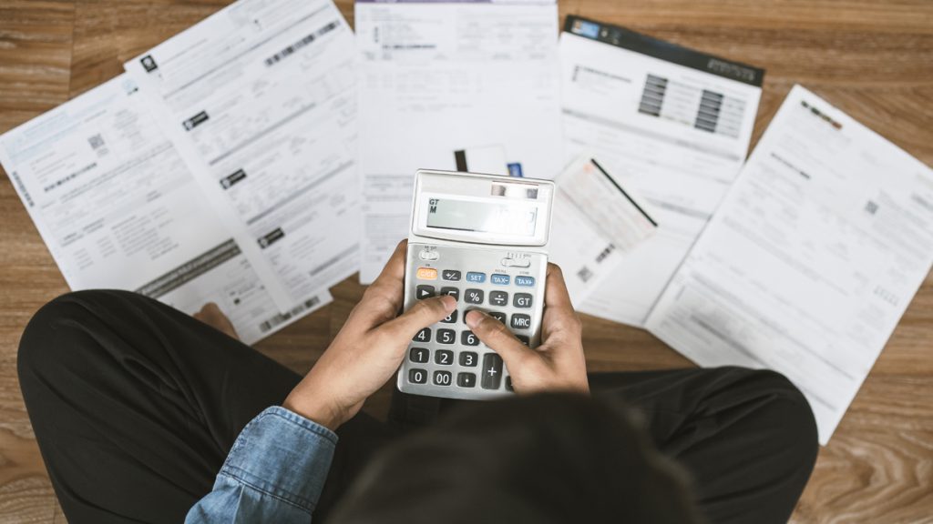 woman calculating debt