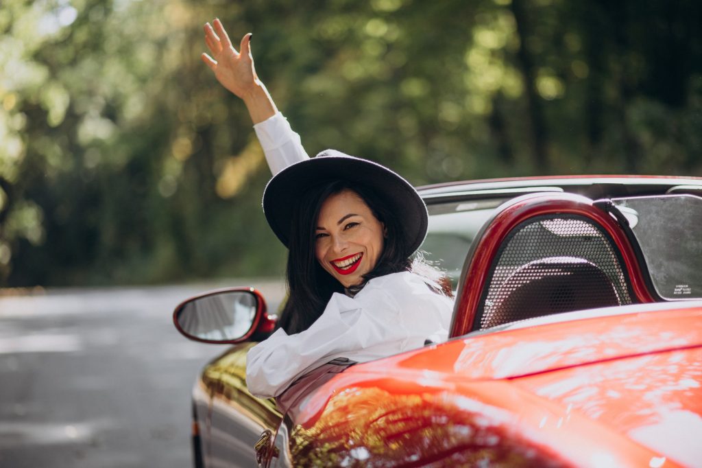 rich woman driving car