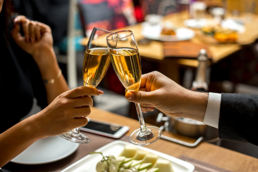 couple holding champagne