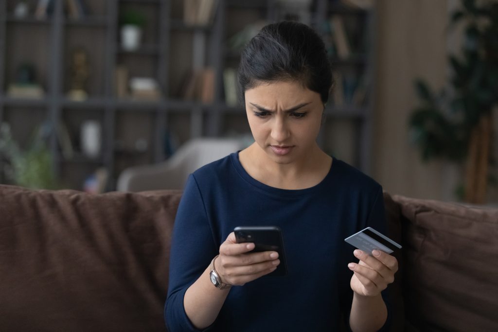 Unhappy woman frustrated by unsuccessful online payment