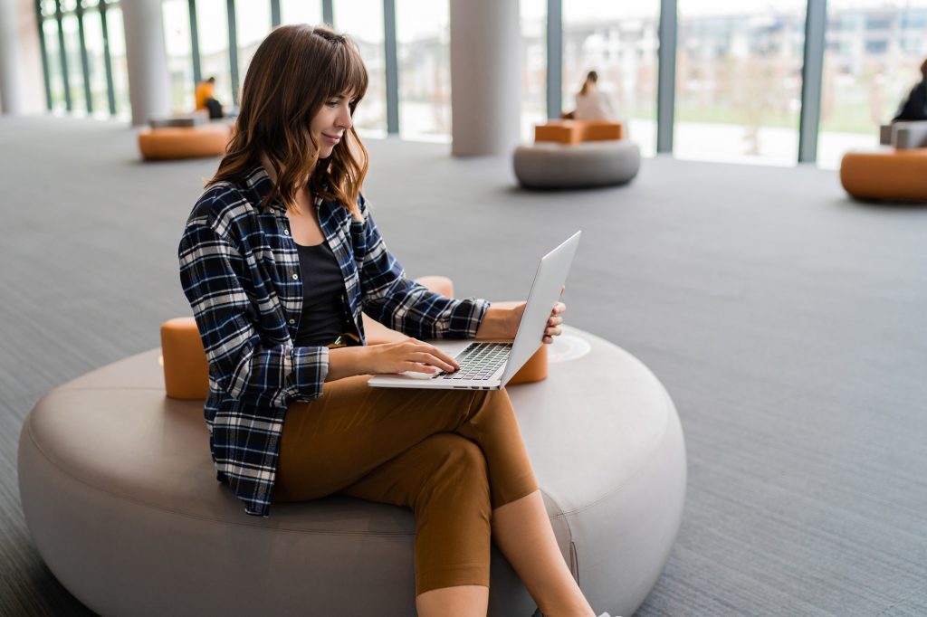 happy woman using laptop