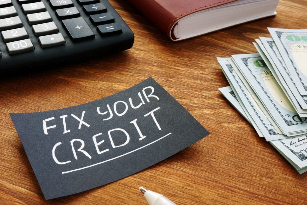 Writing note shows the text Fix your credit