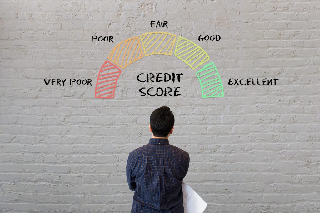 Man staring at wall looking at abstract design credit score mete