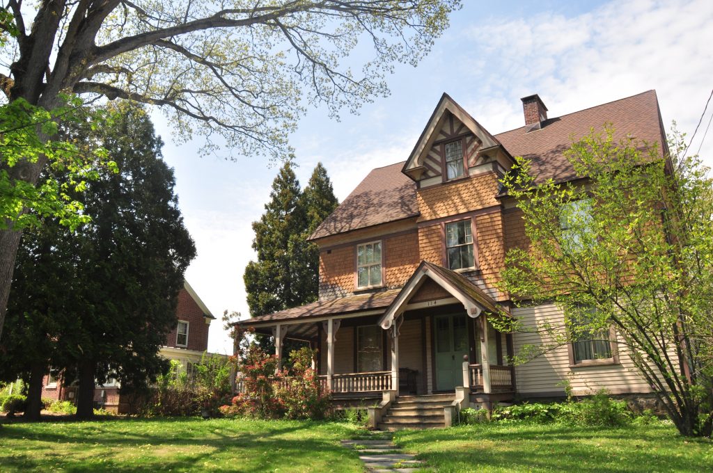 Brown american house style with a garden