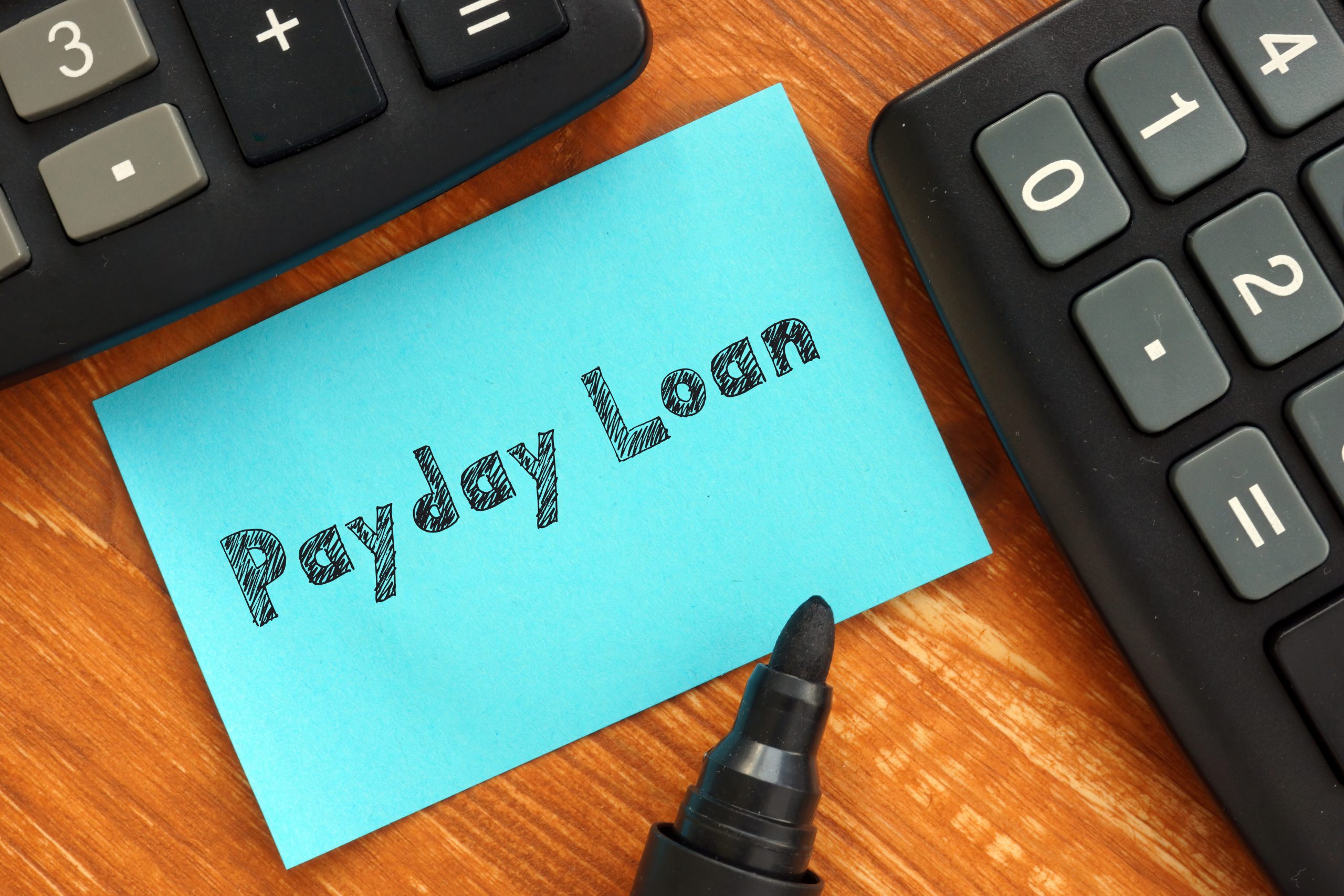 Financial concept meaning Payday Loan with phrase on the sheet.