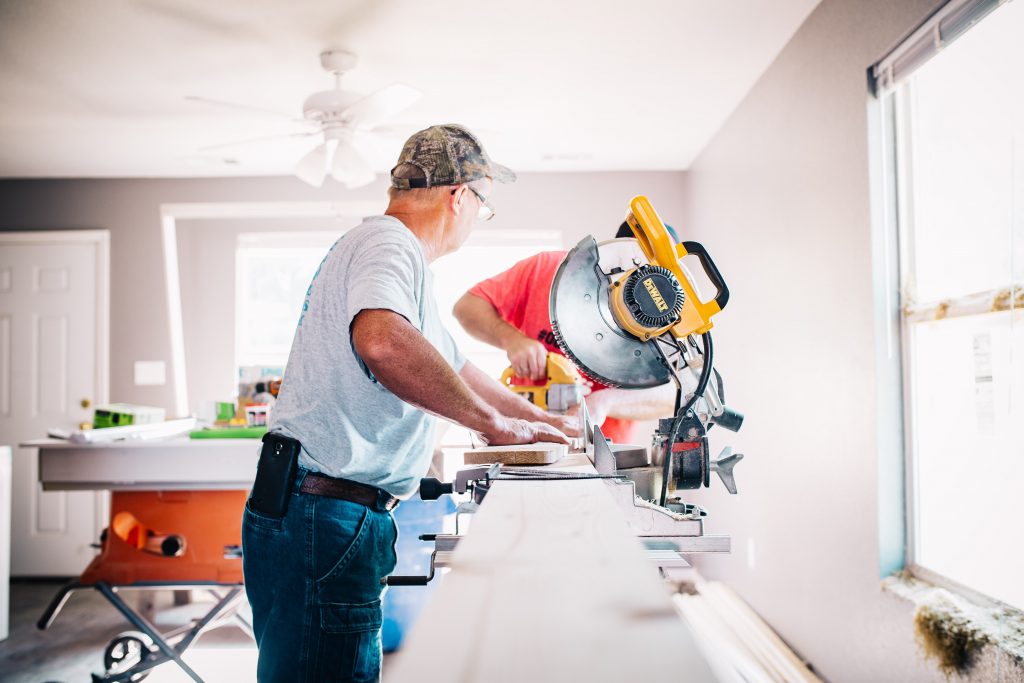 Trades people working on house repairs