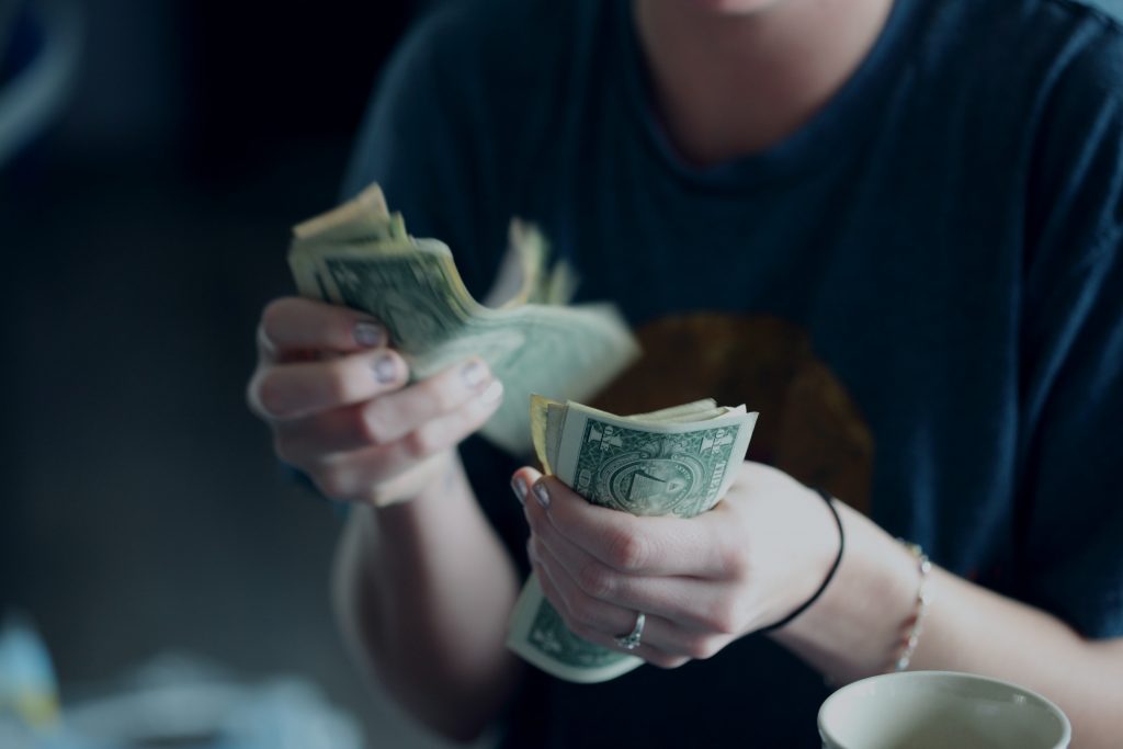 female hands hounding cash