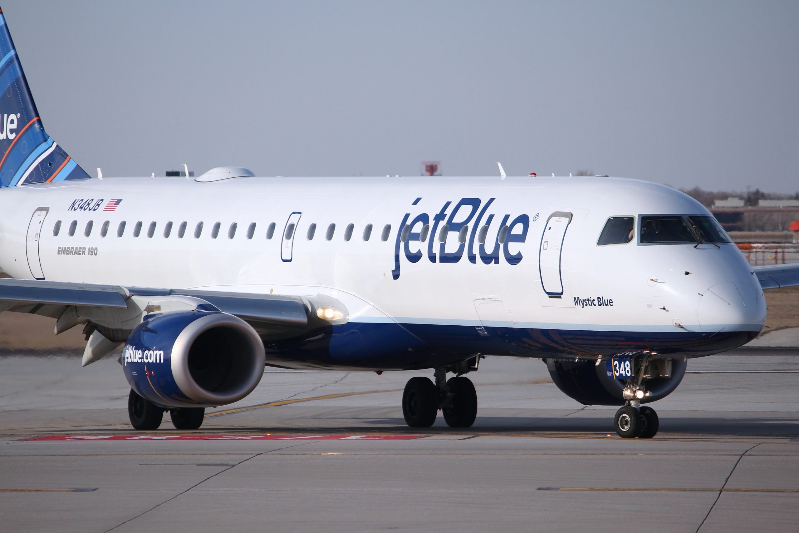 CHICAGO, UNITED STATES - APRIL 1, 2014: Jetblue Embraer taxies after landing at O'Hare Airport in Chicago. JetBlue is an American low-cost airline with 5.4 bn USD revenue in 2013.