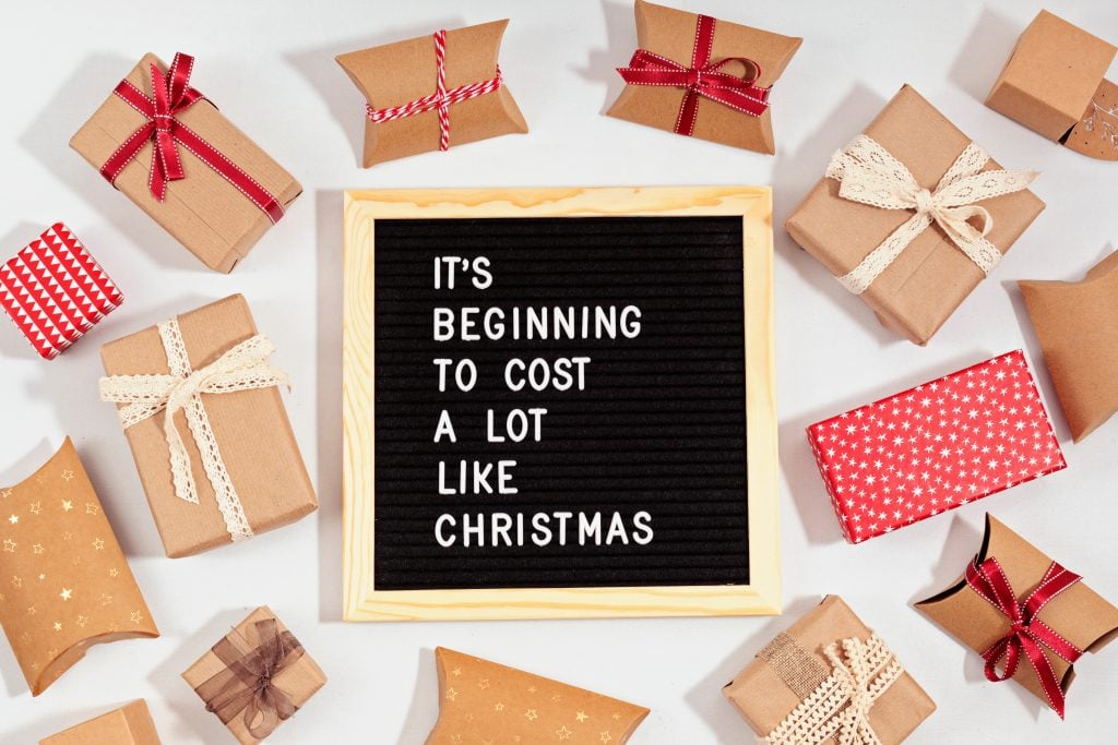 Felt letter board with funny quote text It is beginning to cost a lot like Christmas