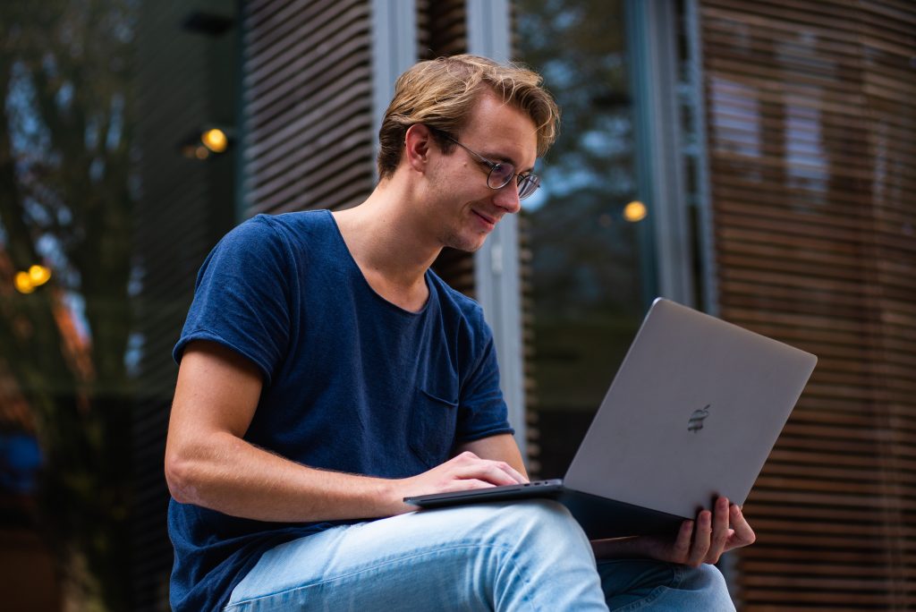 Guy using his laptop