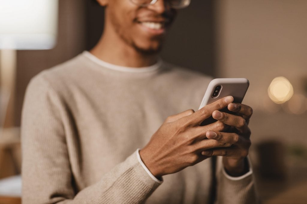 smiley-man-using-modern-smartphone