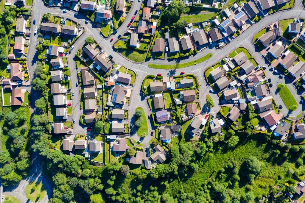 Aerial drone view of small winding sreets and roads in a residen