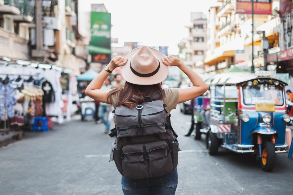 Back view Asian woman tourist backpacker travel in Khao San road