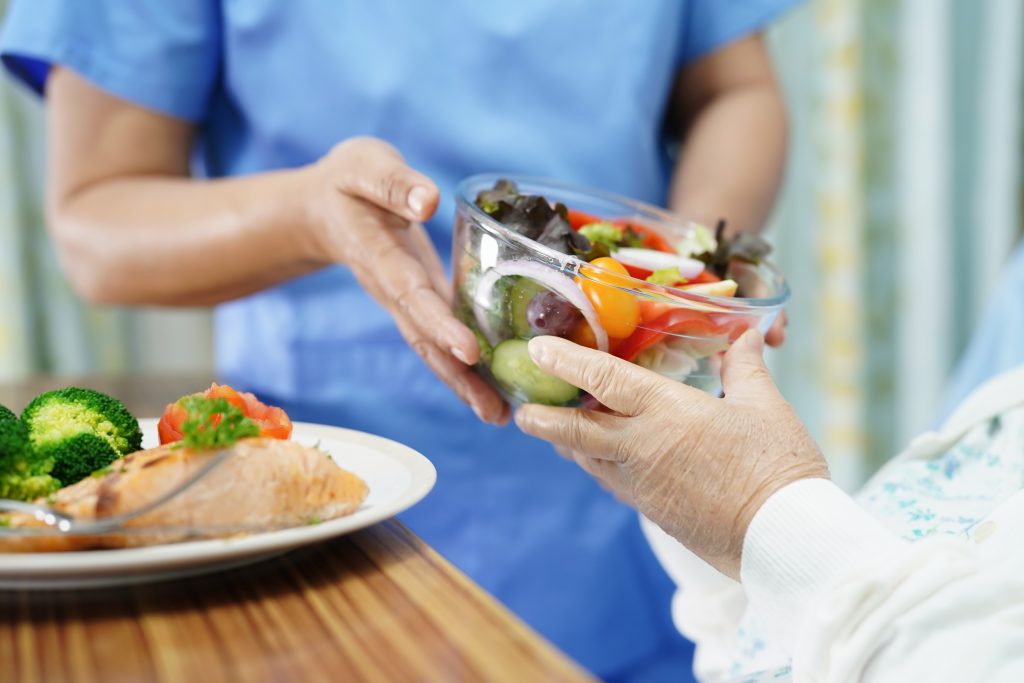 Asian senior or elderly old lady woman patient eating breakfast