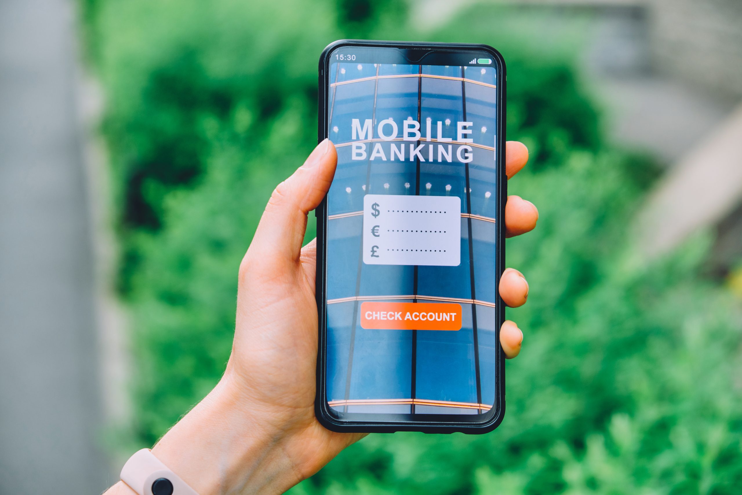 Concept checking account in a smartphone mobile banking interface application in hand