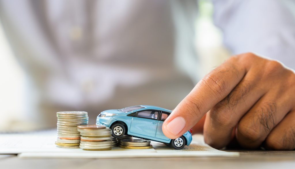 Saving money concept. Car, house, stack of coins.