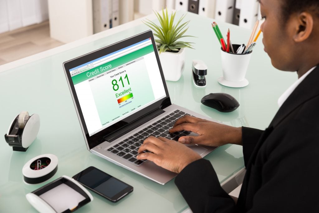 Businesswoman Checking Credit Score On Laptop